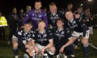 Dundee academy graduates with the Championship trophy