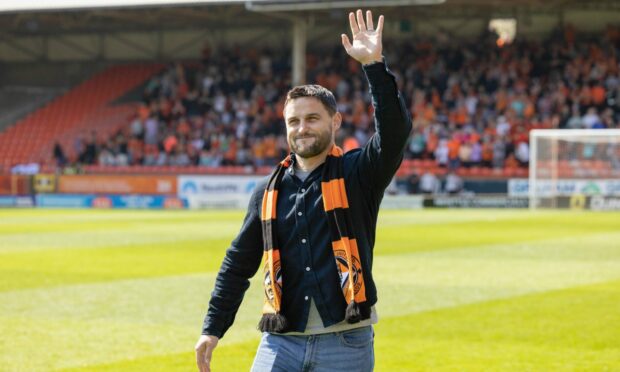 Conway takes the acclaim of the Tannadice crowd last month. Image: SNS