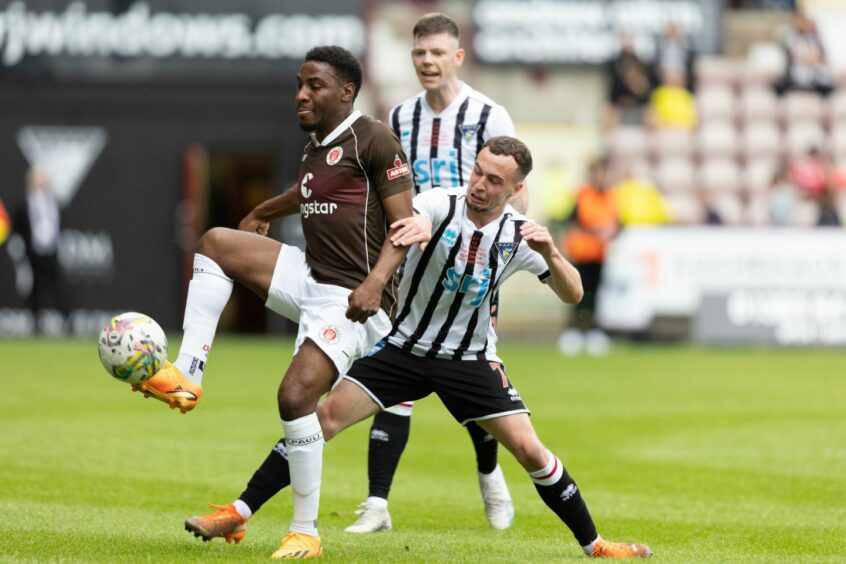 Chris Hamilton and Sam Fisher challenge for the ball during Dunfermline's friendly against St Pauli.