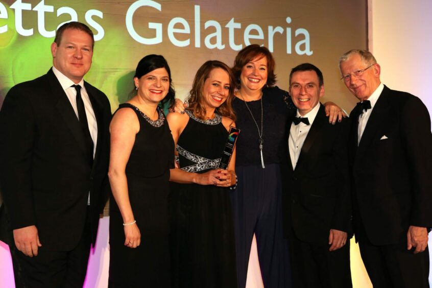 Jannettas Gelateria on stage collecting price at The Courier Business Awards 2014.