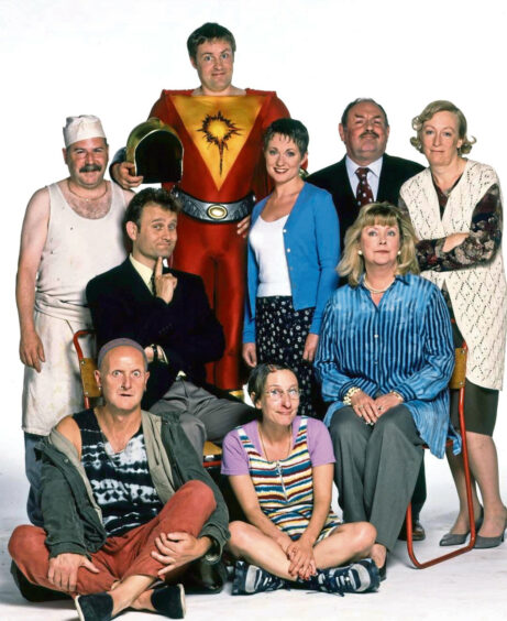 The image shows the cast of sitcom My Hero which was created by Paul A Mendelson, author of The Forever Moment.