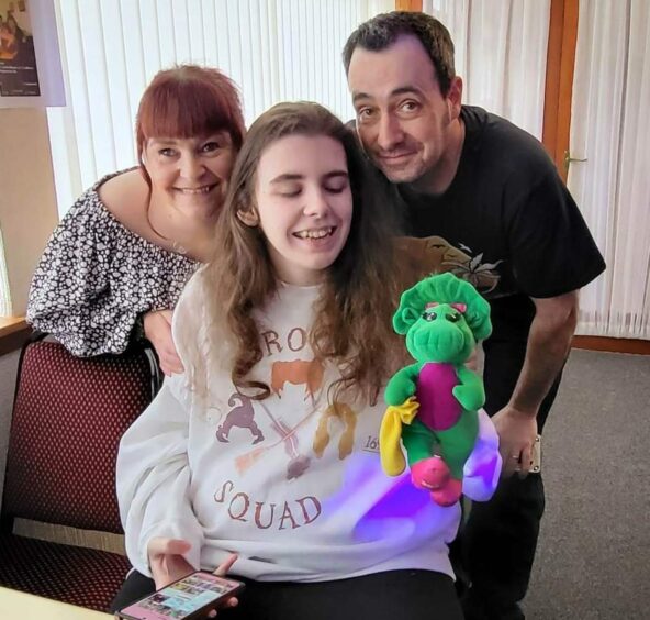 Autistic Fife teenager Alannah Quin pictured with her parents.