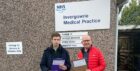 Alasdair Bailey with fellow councillor Brian Leishman at Invergowrie Medical Centre when they did the petition in March 2023. Image: Alasdair Bailey.