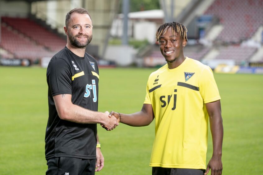 Ewan Otoo, pictured with James McPake, signed a three-year deal. Image: Craig Brown.