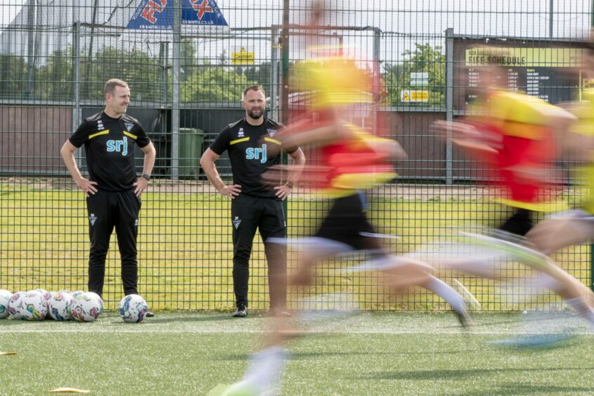 Dave Mackay and James McPake put the Dunfermline players through their paces. Image: Craig Brown.