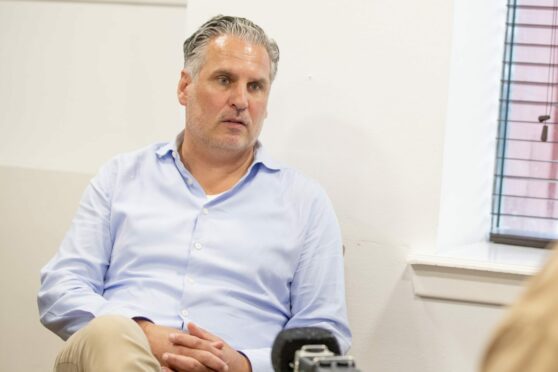 Dunfermline Athletic sporting director Thomas Meggle in discussions at East End Park. Image: Craig Brown / DAFC.