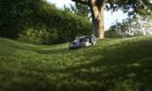 Robot mower cutting grass