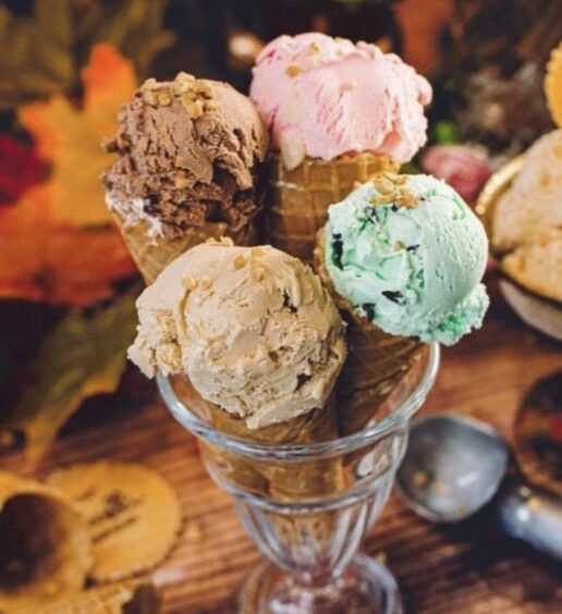 A glass to buy with four different flavours of ice cream.