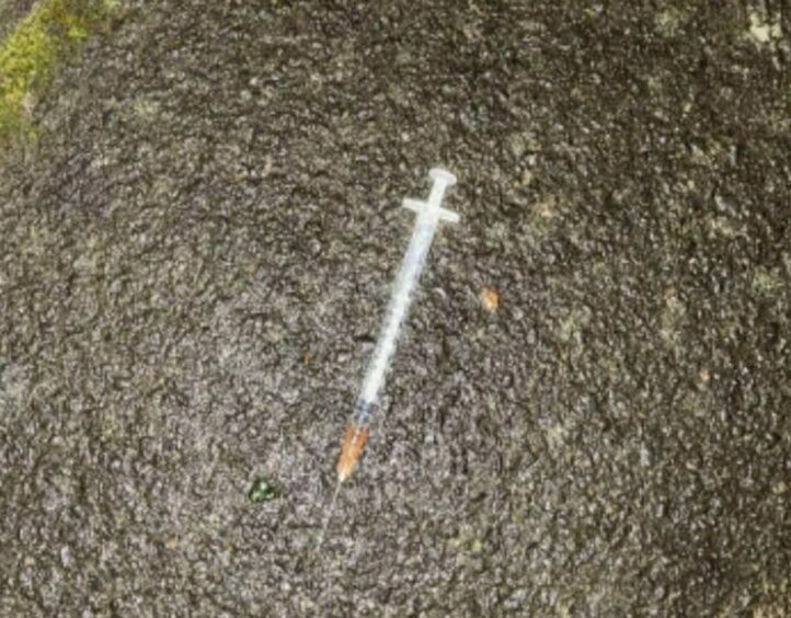 A needle discarded at a block of flats in Dundee