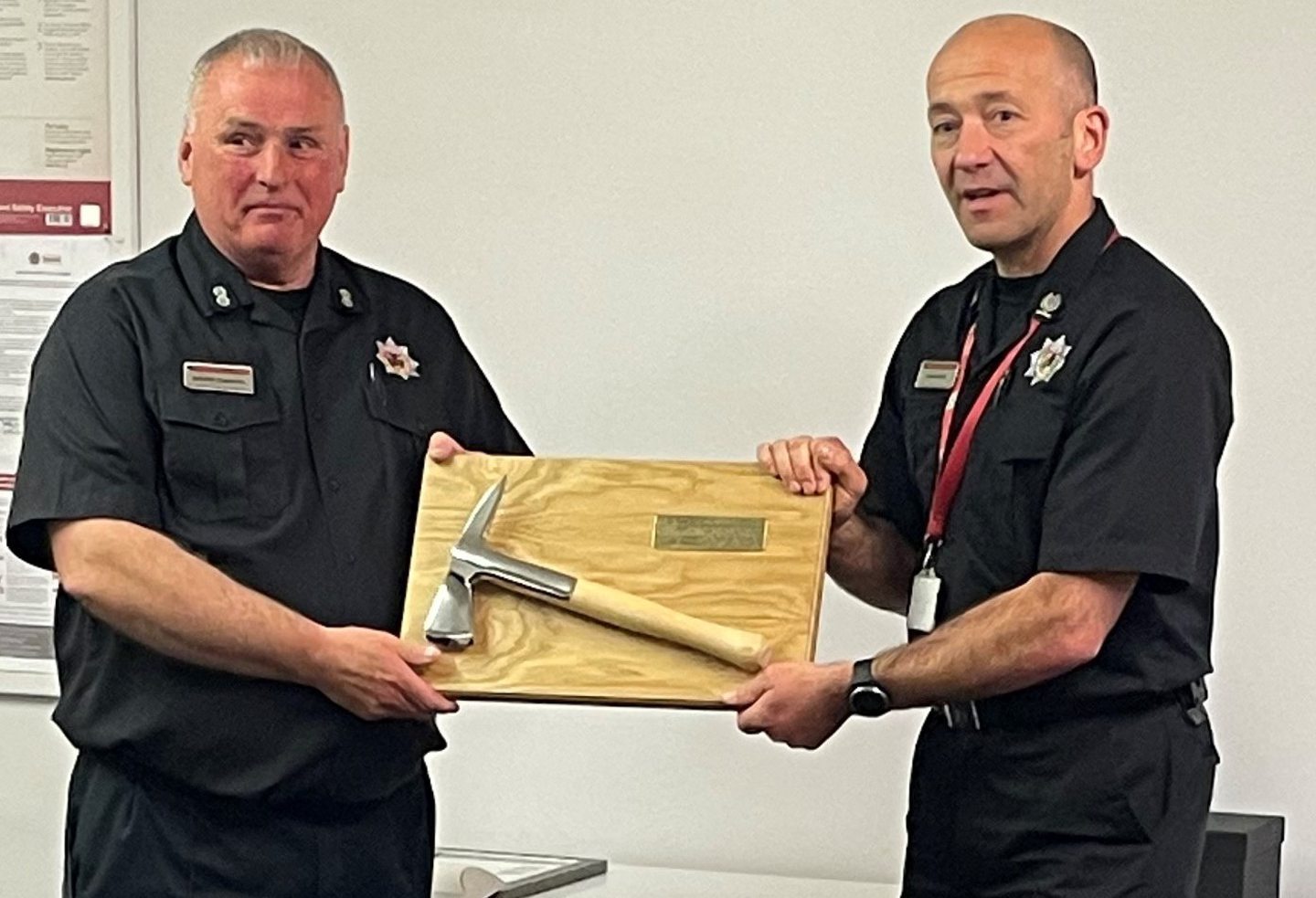 George Ferguson receives fire service axe from Scottish Fire and Rescue Service area commander Jason Sharp in Comrie.