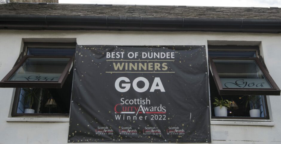 'Scottish Curry Awards Winner 2022' sign outside Goa restaurant.