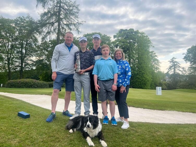 Connor Graham with his family after winning the Scottish Men's Championship.