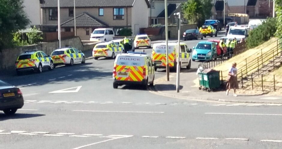 Police on Mains Road in Dundee
