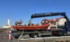 The Atlantic 85 is craned into Arbroath harbour. Image: Graham Brown/DC Thomson