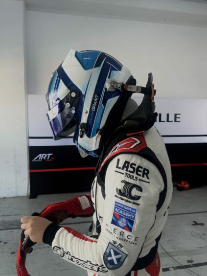 Chloe Grant prepares to get in her car for Round 2 of F1 Academy in Valencia. Image: Fierce Sports Marketing.