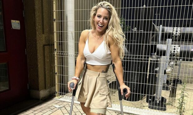 Gladiators competitor Sheli McCoy on crutches