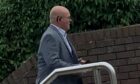 Ian Robertson leaving Dunfermline Sheriff Court