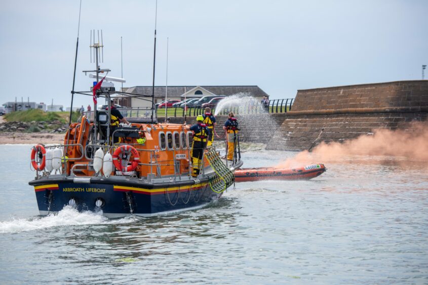 The lifeboats in action at close quarters.