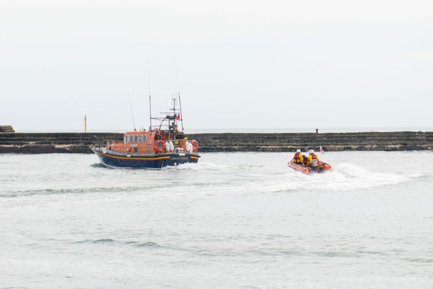 The lifeboats on exercise in the harbour.