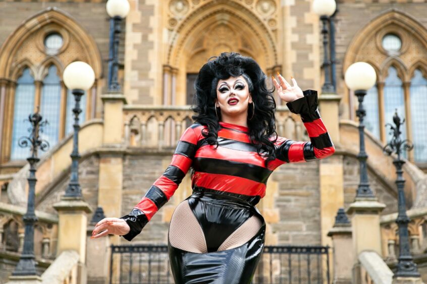 Drag queen Ellie Diamond in a Dennis the Menace-inspired outfit outside The McManus museum