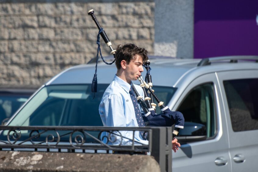A piper plays at the funeral of former Broughty Ferry lifeboatman Frank Donnelly. Photo by Kim Cessford / DC Thomson.