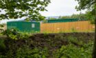 Behind a undistinctive wooden fence is a £20m battery storage facility in Dundee. Image: Kim Cessford/DC Thomson
