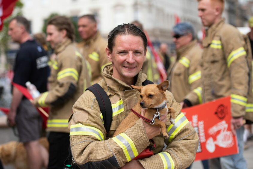 Firefighter John Ford and his dog, Orlagh.