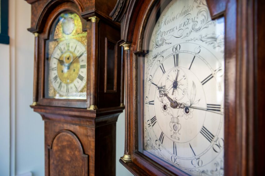 Two of the grandfather clocks in the exhibition