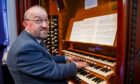 Robin Bell plays the organ at Caird Hall which is celebrating its centenary year this year.
