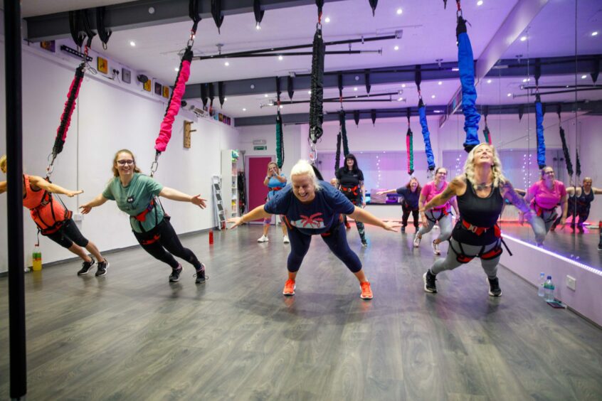 Debbie learns to do her first trust fall at Bungee Fit. Image: Kenny Smith/DC Thomson