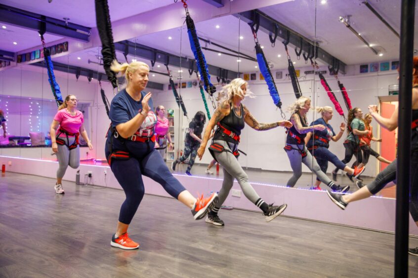 Debbie joins the class as they launch into the cardio routine at Bungee Fit. Image: Kenny Smith/DC Thomson