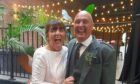Bubbly Karen Morris and husband Neil at the wedding of their son last year.