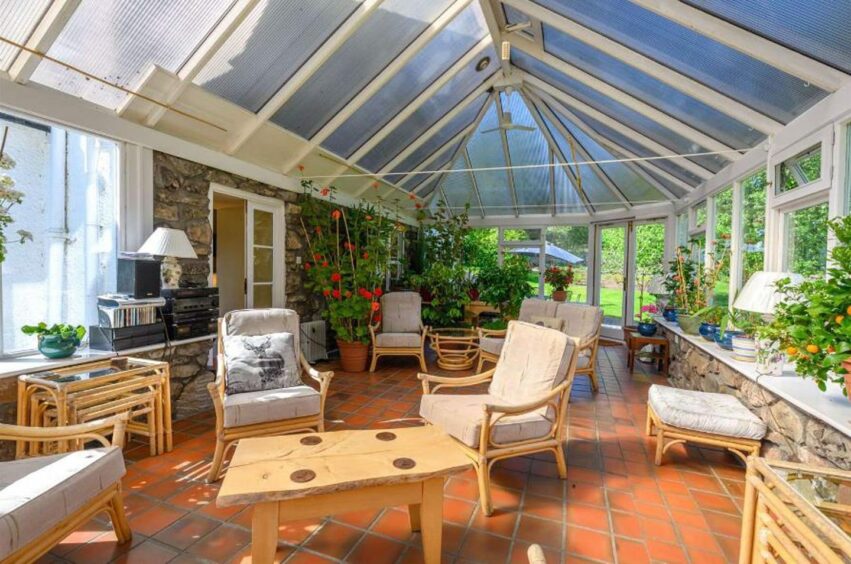 The conservatory is linked to the sitting room