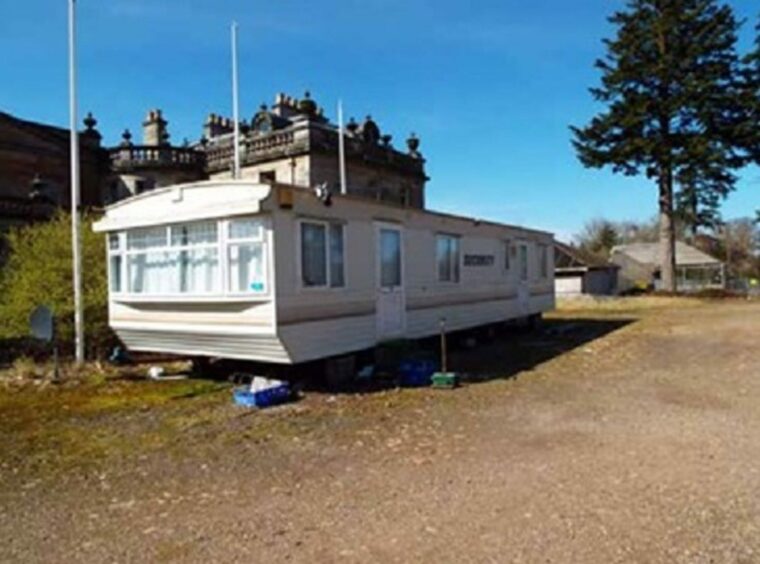 An unauthorised security caravan that sat outside the hotel for years.