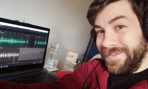 Lewis Harrower, founder of Time Capsule Productions, editing a documentary from his home in Dunfermline.