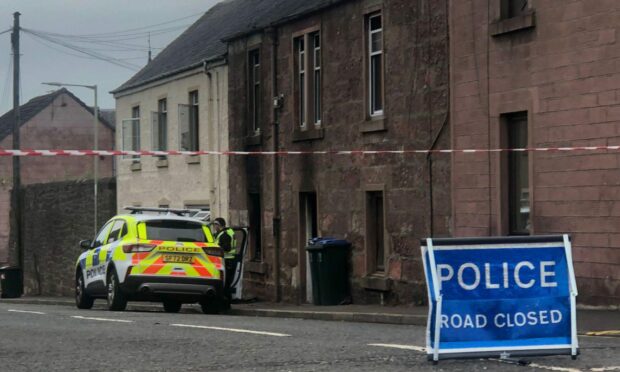 Police at the scene of the fatal fire on John Street in Blairgowrie