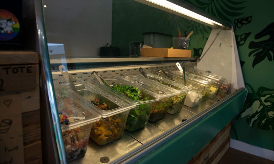 A deli counter stocked with different salads for takeaways in The Little Green Larder.