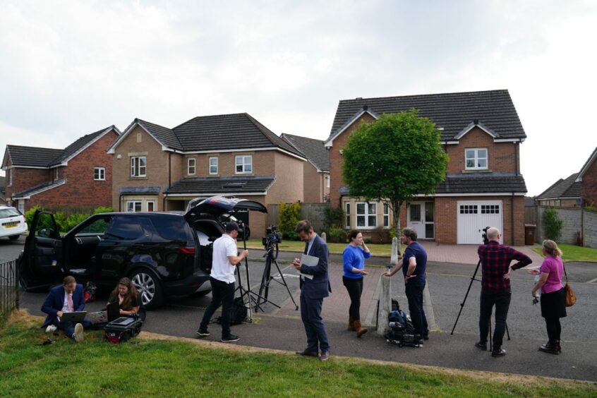 Large group of reporters and camera crews outside Nicola Sturgeon's home.