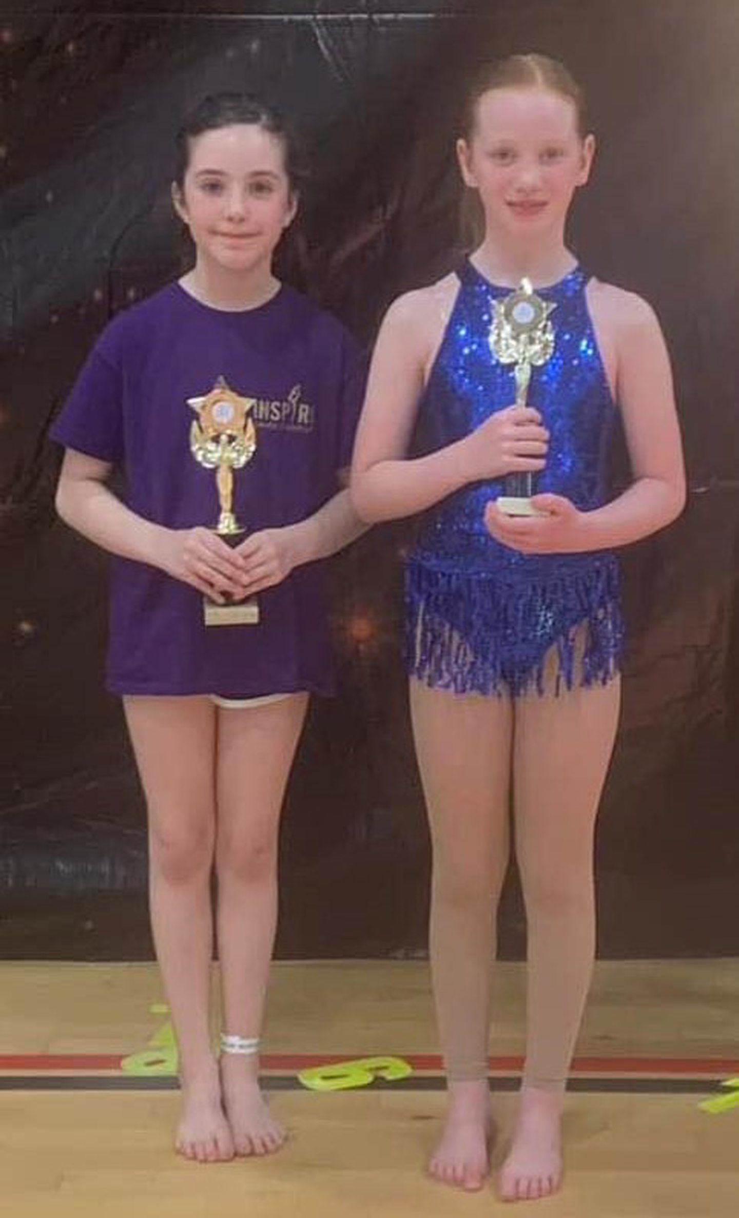 Perth - Inspire Dance Studio's Eleanor Brown and Freya Simpson holding their WLDF trophies.