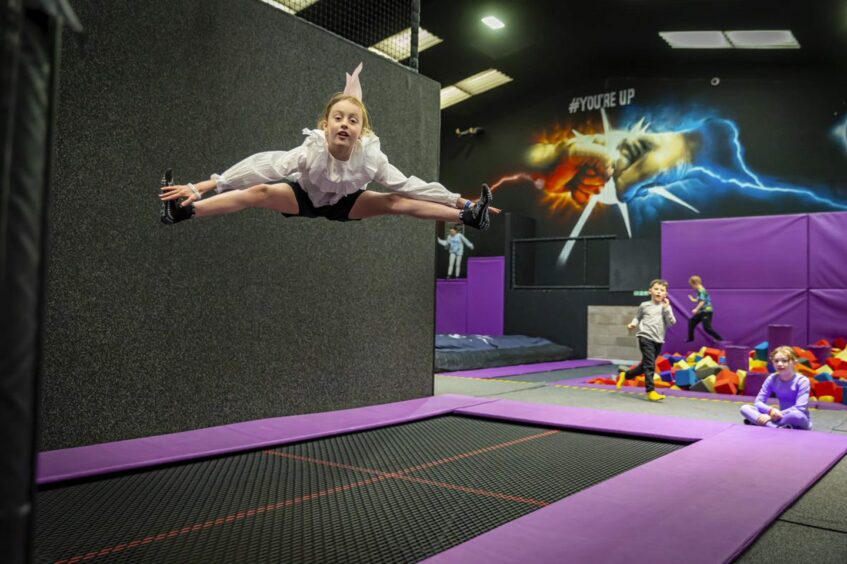 A girl bouncing on a trampoline at Ryze Dundee