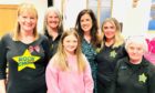 Rachel Leitch (second right) and family with Rock Choir creator and creative director, Caroline Redman Lusher. Image: Rachel Leitch