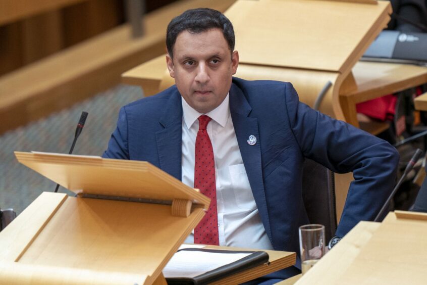Scottish Labour leader Anas Sarwar looking pensive in the debating chamber at the Scottish Parliament in Holyrood.