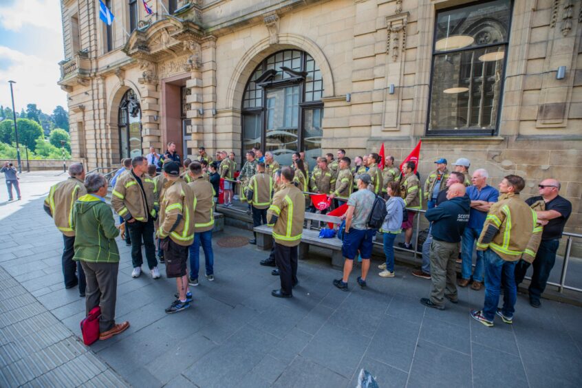 Scenes from the gathering outside Perth and Kinross Council headquarters.