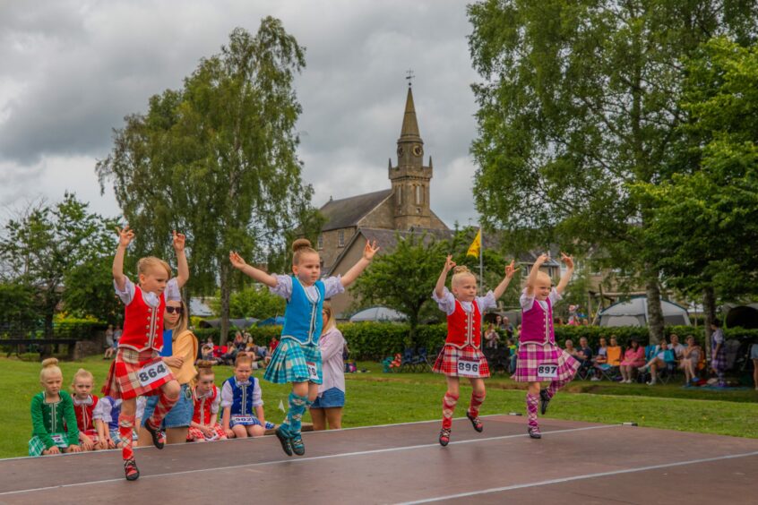 Four young girls competing in dance.