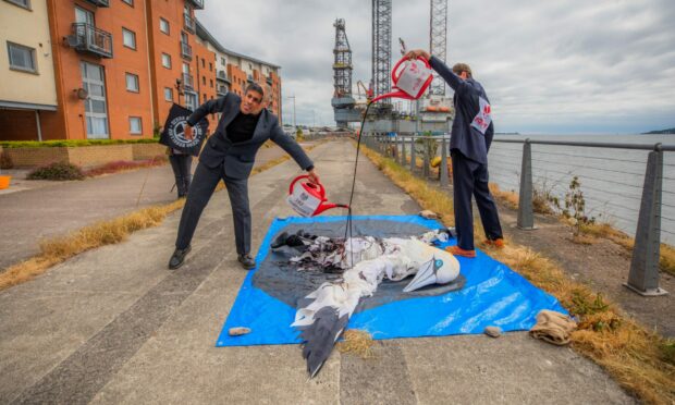 Ocean Rebellion protesters at the protest in Dundee against the Rosebank Oil field.