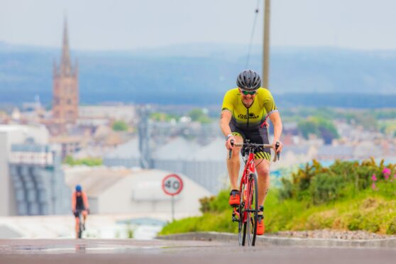 Alan Dick leaves Montrose behind in the cycle leg. Image: Steve MacDougall/DC Thomson