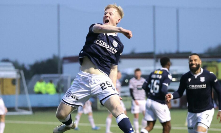 Lyall Cameron celebrates as Dundee win the Championship at Queen's Park. Image: PA