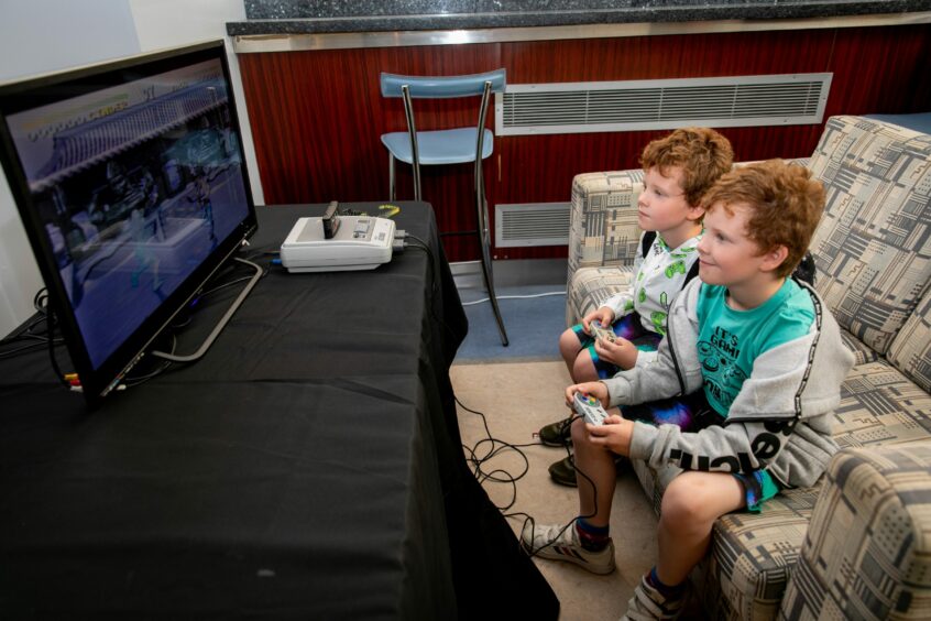 Brothers Garry (7) and Andrew McLean (7) enjoy some retro Nintendo.