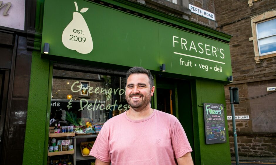 Fraser Reid standing outside his Dundee fruit and vegetable shop