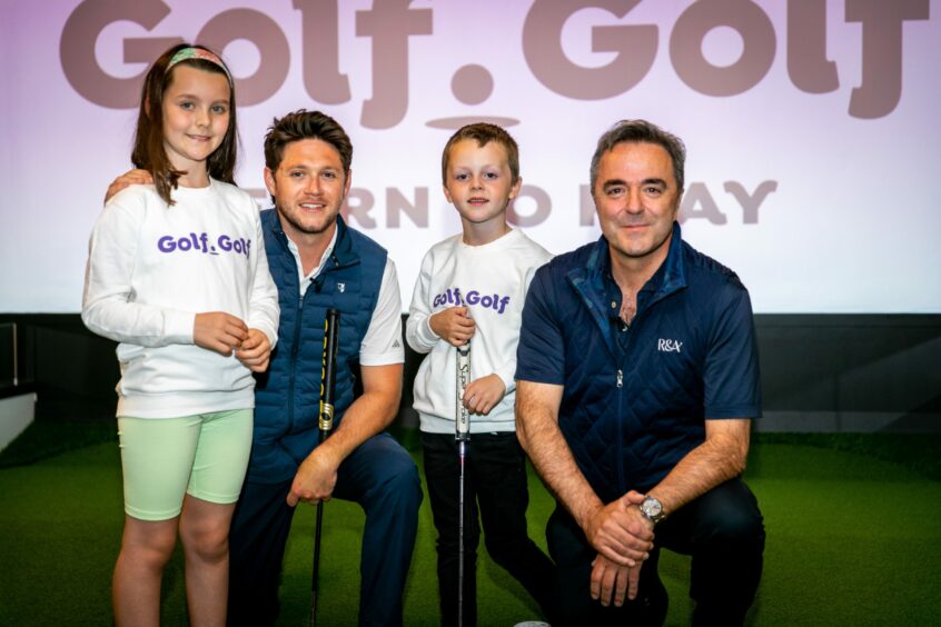 Seven-year-olds Olivia Farquhar and Ruaridh McCallum with Niall Horan and R&A chief development officer Phil Anderton at the Golf.Golf Launch event in St Andrews